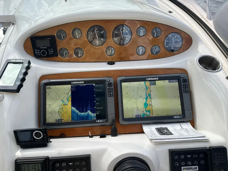 Slide: The Image of 1997 Sunseeker Camargue dashboard with navigation screens and control instruments. - 3