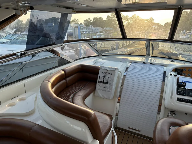 Slide: The Image of Luxurious 1997 Sunseeker Camargue yacht interior with leather seating and control panel. - 9