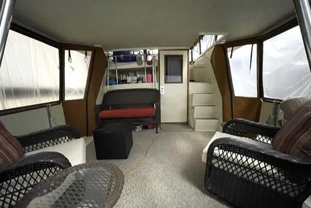 Slide: The Image of 1984 Uniflite Double Cabin interior with seating and stairs. - 12