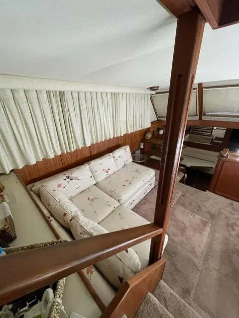 Slide: The Image of 1984 Uniflite Double Cabin interior with cozy seating area and wooden accents. - 14
