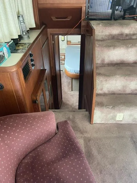 Slide: The Image of 1984 Uniflite Double Cabin interior with stairs leading to bedroom. - 16