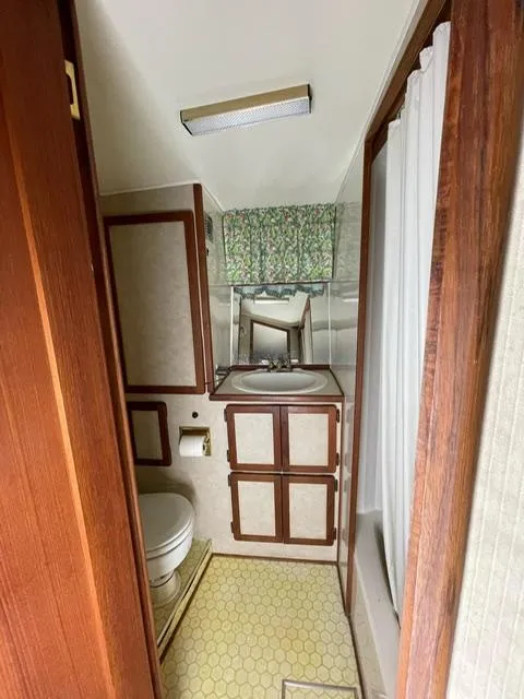 Slide: The Image of 1984 Uniflite Double Cabin bathroom with sink, toilet, and shower. - 19