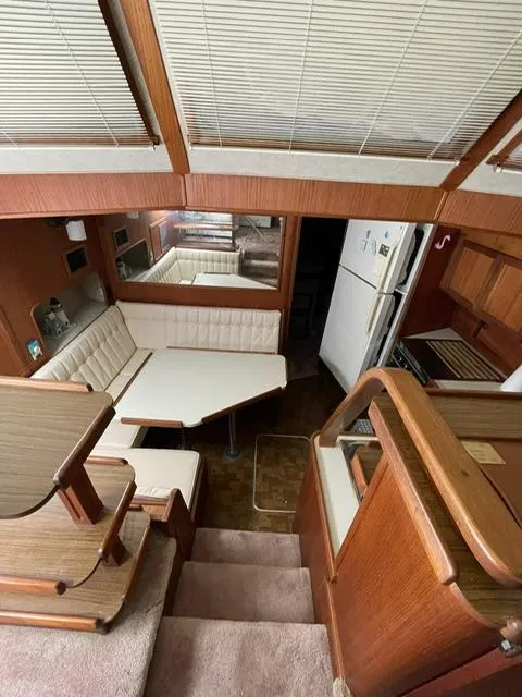 Slide: The Image of 1984 Uniflite Double Cabin interior with dining area and kitchen. - 22