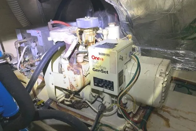 Slide: The Image of 1984 Uniflite Double Cabin engine room with Onan Marine GenSet. - 40