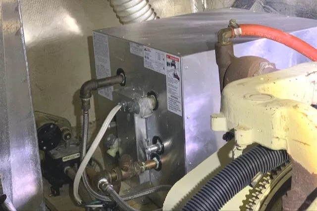 Slide: The Image of 1984 Uniflite Double Cabin engine compartment with mechanical components. - 42