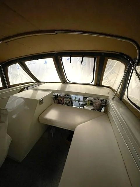 Slide: The Image of 1984 Uniflite Double Cabin interior with helm and seating area. - 8