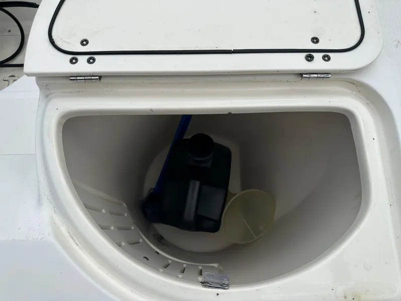 Slide: The Image of Storage compartment of a 2000 Boston Whaler 23 Outrage boat. - 17
