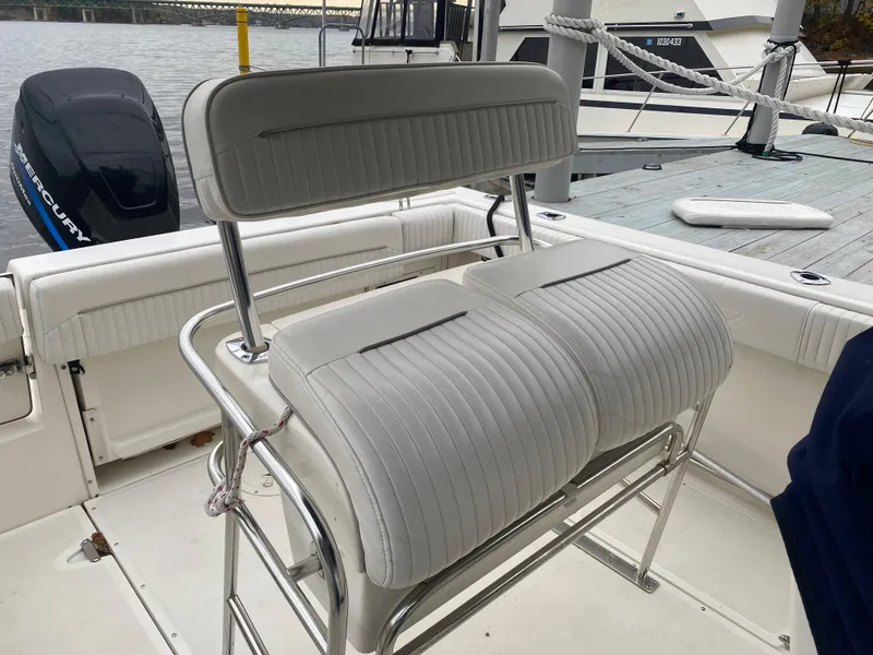 Slide: The Image of Boston Whaler 23 Outrage 2000 boat interior with dual seat and outboard motor. - 4