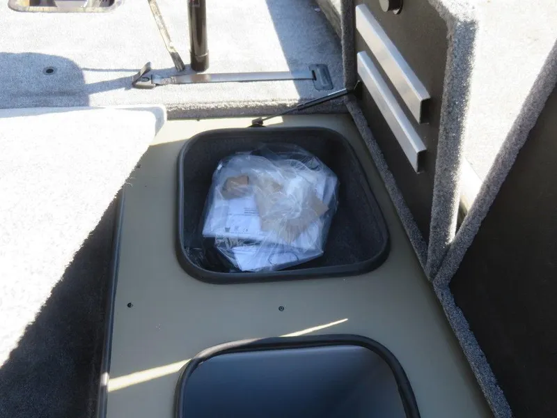 Slide: The Image of 2024 Ranger RT188P storage compartment with documents and accessories. - 14