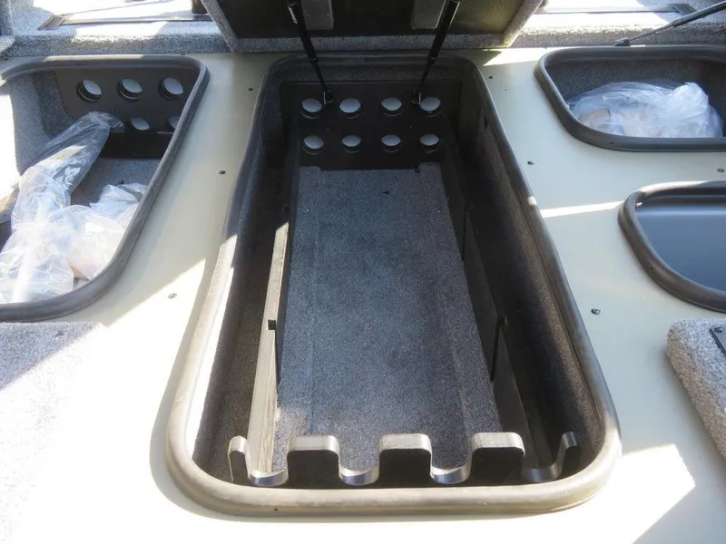 Slide: The Image of 2024 Ranger RT188P boat storage compartments and rod holders. - 16