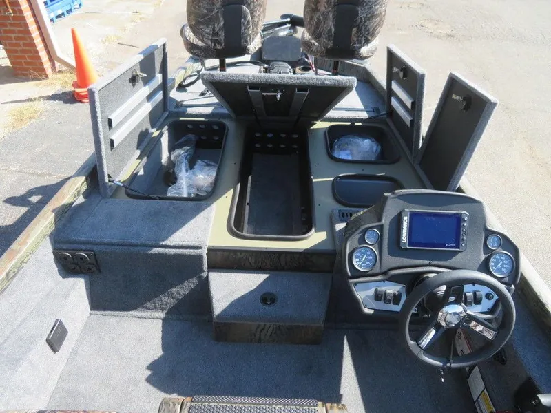 Slide: The Image of 2024 Ranger RT188P boat interior with steering console, storage compartments, and seating. - 19