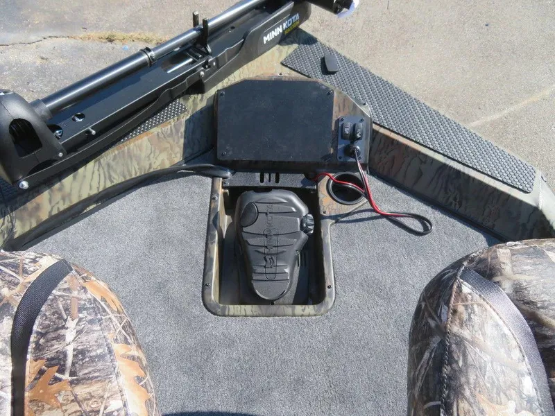 Slide: The Image of 2024 Ranger RT188P boat interior with Minn Kota trolling motor and camo seats. - 22