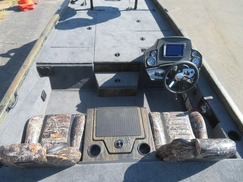 Slide: The Image of 2024 Ranger RT188P fishing boat interior with camo seats and modern dashboard. - 6