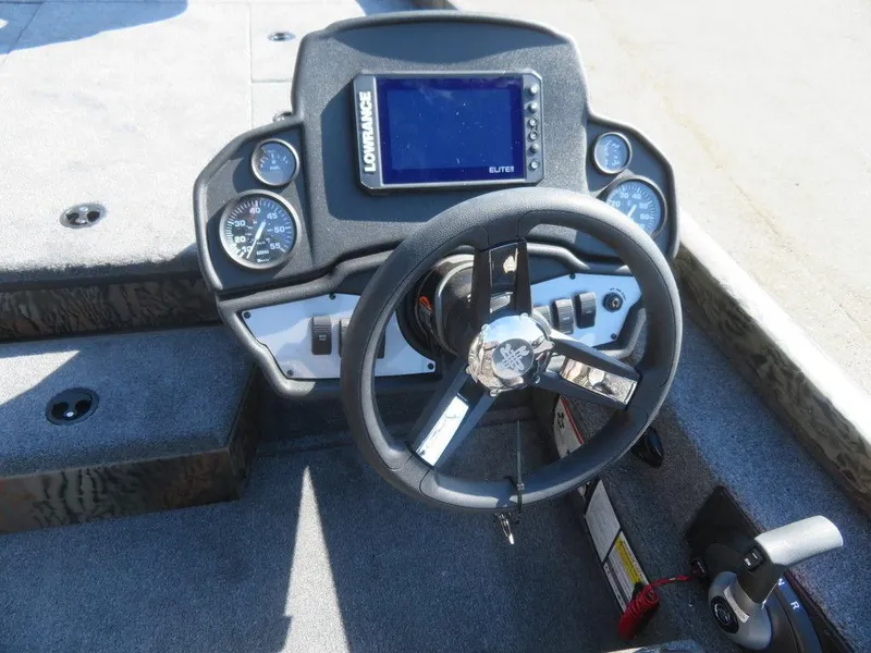 Slide: The Image of 2024 Ranger RT188P boat dashboard with Lowrance Elite fishfinder and steering wheel. - 7