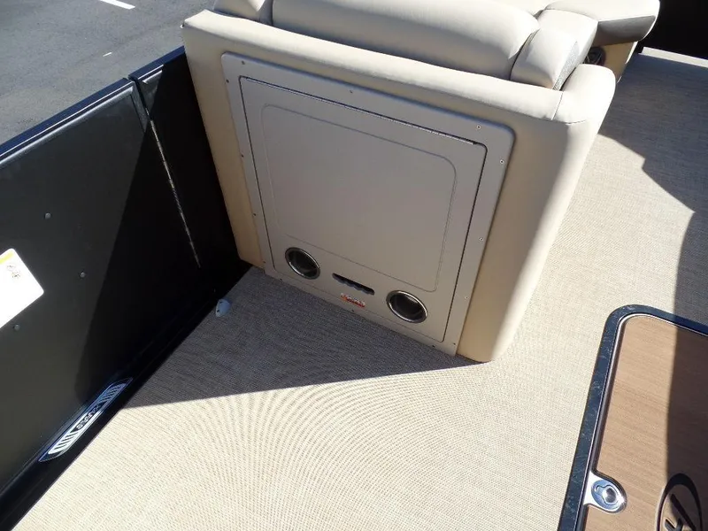 Slide: The Image of 2024 Harris Sunliner 230 boat interior seating and storage compartment. - 12