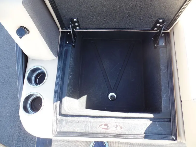 Slide: The Image of Open storage compartment in 2024 Harris Sunliner 230 boat with cup holders. - 15