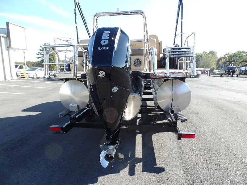 Slide: The Image of 2024 Harris Sunliner 230 pontoon boat with powerful outboard motor. - 18
