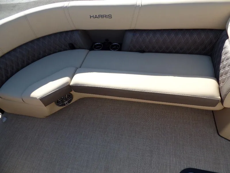 Slide: The Image of 2024 Harris Sunliner 230 boat interior with beige and gray seating. - 6