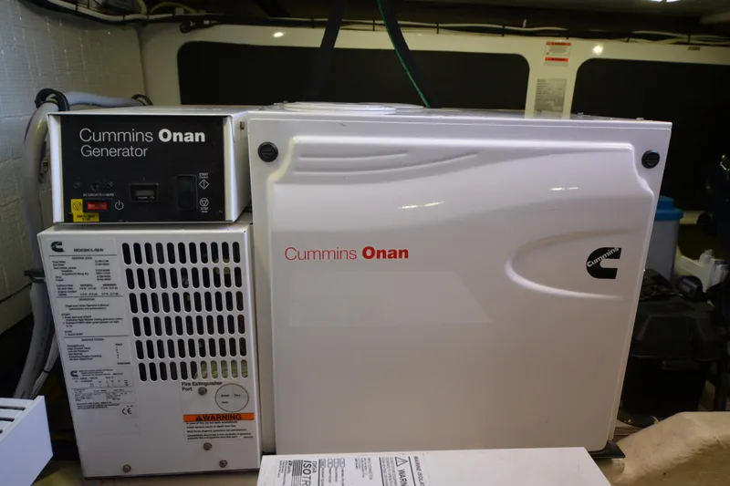 Slide: The Image of Cummins Onan generator inside 2014 Sabre 42 Salon Express yacht engine room. - 43