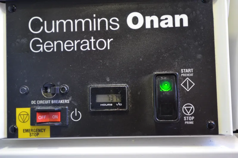 Slide: The Image of Cummins Onan generator control panel on 2014 Sabre 42 Salon Express yacht. - 44