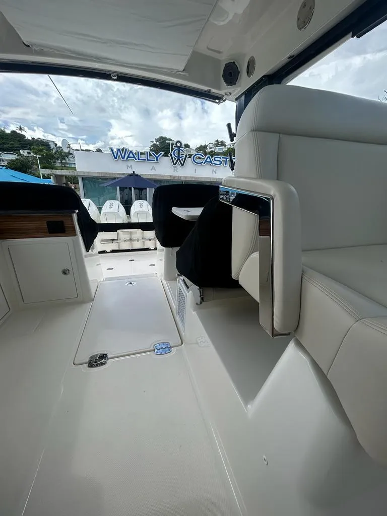Slide: The Image of 2024 Boston Whaler 405 Conquest interior with sleek seating and modern design. - 7