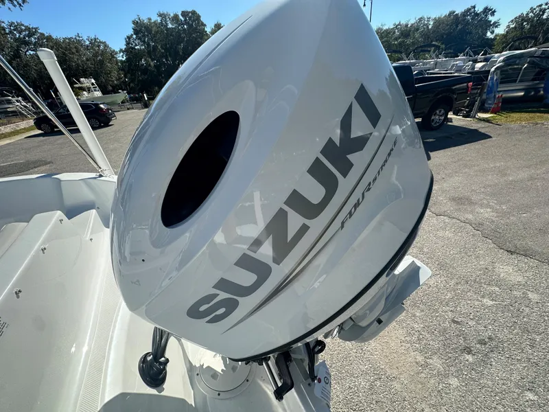 Slide: The Image of 2024 Hurricane SunDeck Sport 188 OB with Suzuki outboard motor. - 12