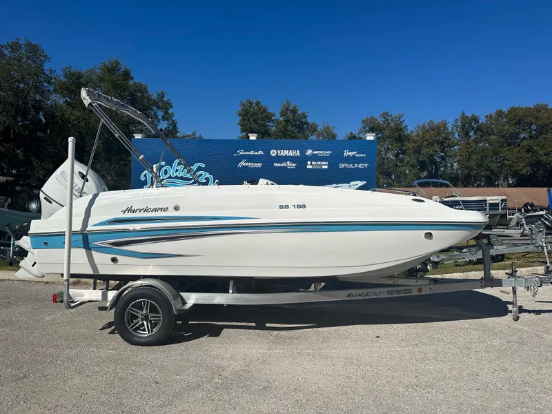 The Image of 2024 Hurricane SunDeck Sport 188 OB boat on a trailer, side view. - 2