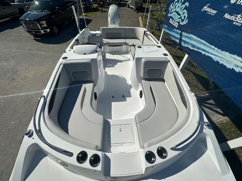 Slide: The Image of 2024 Hurricane SunDeck Sport 188 OB boat with spacious seating and modern design. - 4