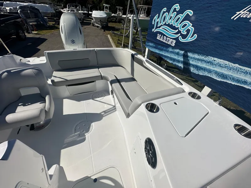 Slide: The Image of 2024 Hurricane SunDeck Sport 188 OB boat interior with seating and storage compartments. - 7
