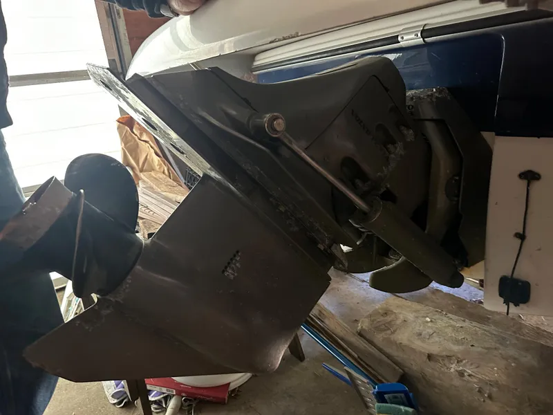 Slide: The Image of 2003 Four Winns 180 Freedom I/O boat outdrive in a garage. - 4