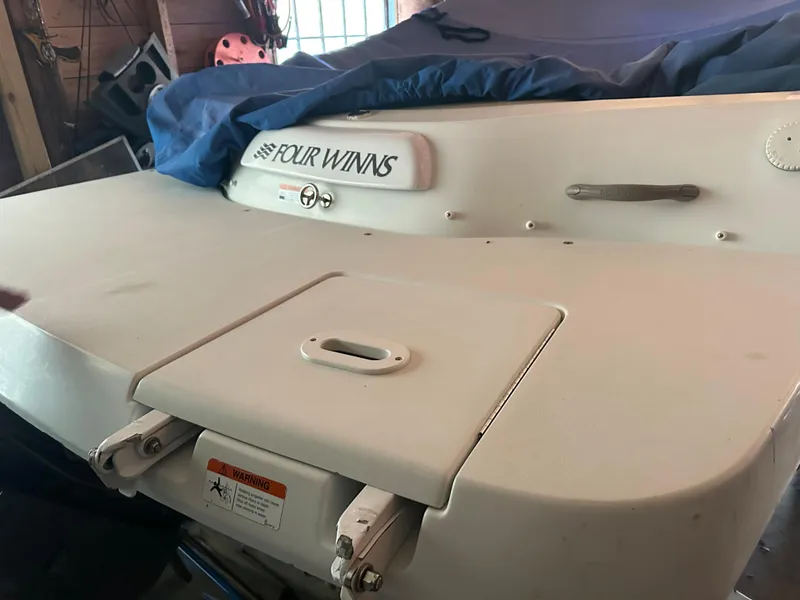 Slide: The Image of 2003 Four Winns 180 Freedom I/O boat rear view in storage. - 5