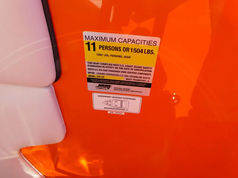 Slide: The Image of 2024 Crownline 240 SS LPX boat capacity label, 11 persons or 1504 lbs. - 12