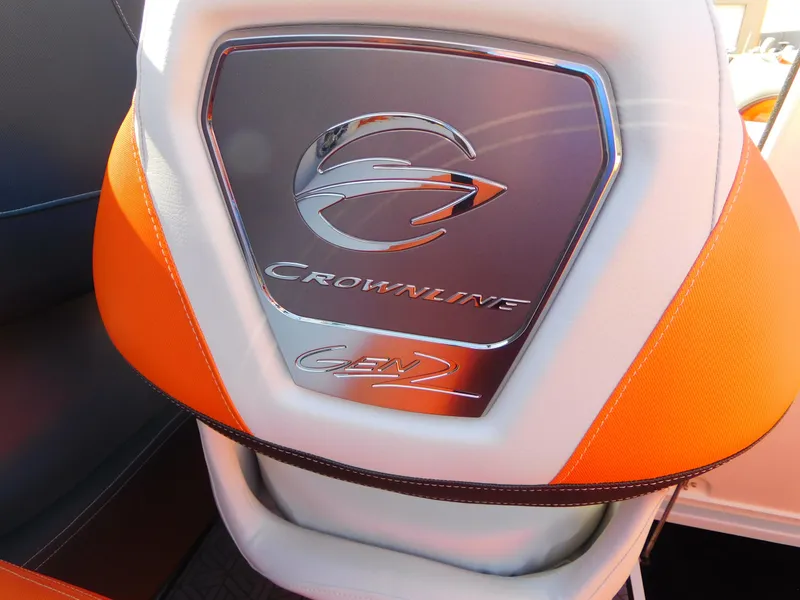 Slide: The Image of 2024 Crownline 240 SS LPX boat seat with logo and orange accents. - 16