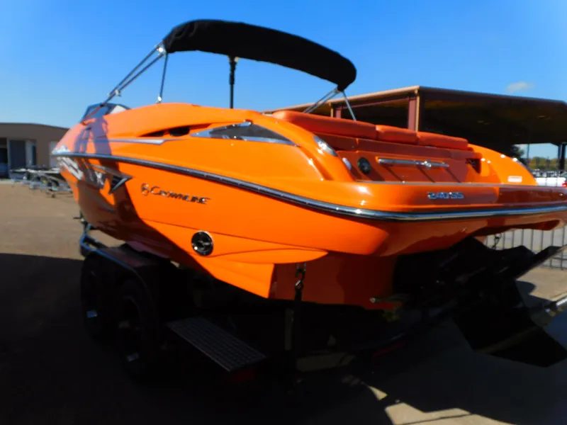 Slide: The Image of 2024 Crownline 240 SS LPX boat in vibrant orange, rear view. - 2