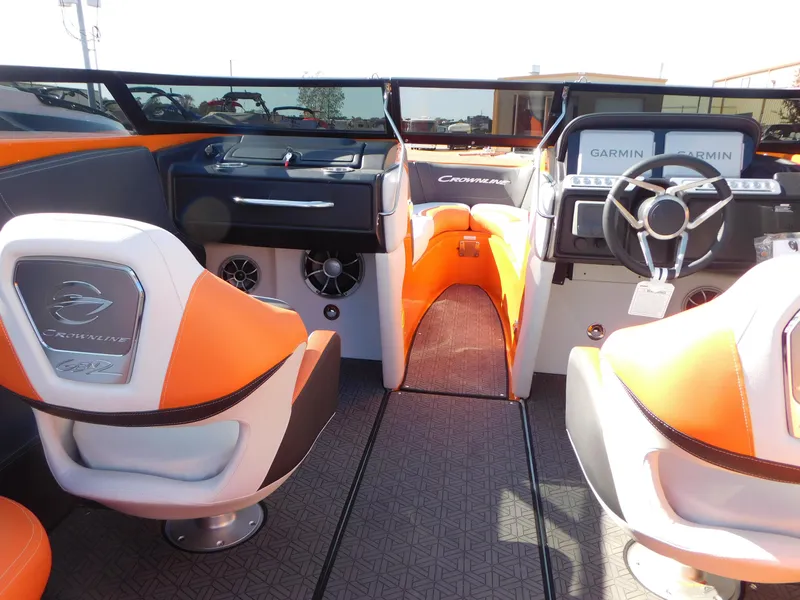Slide: The Image of 2024 Crownline 240 SS LPX boat interior with orange and white seats, Garmin navigation. - 6