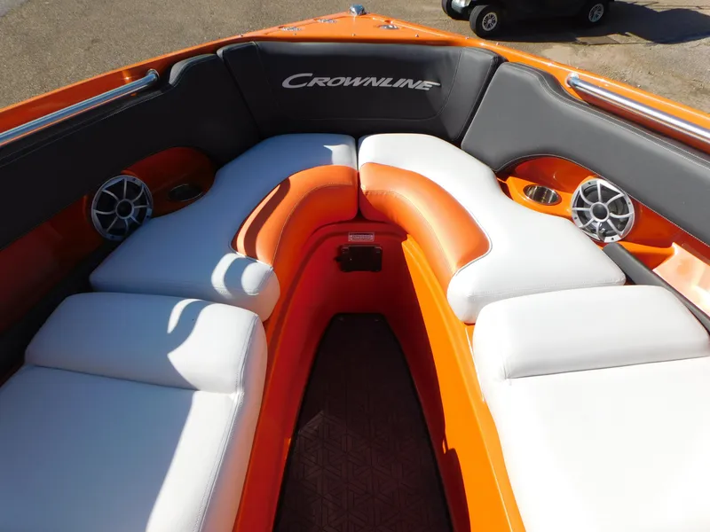Slide: The Image of 2024 Crownline 240 SS LPX boat interior with orange and white seating. - 8
