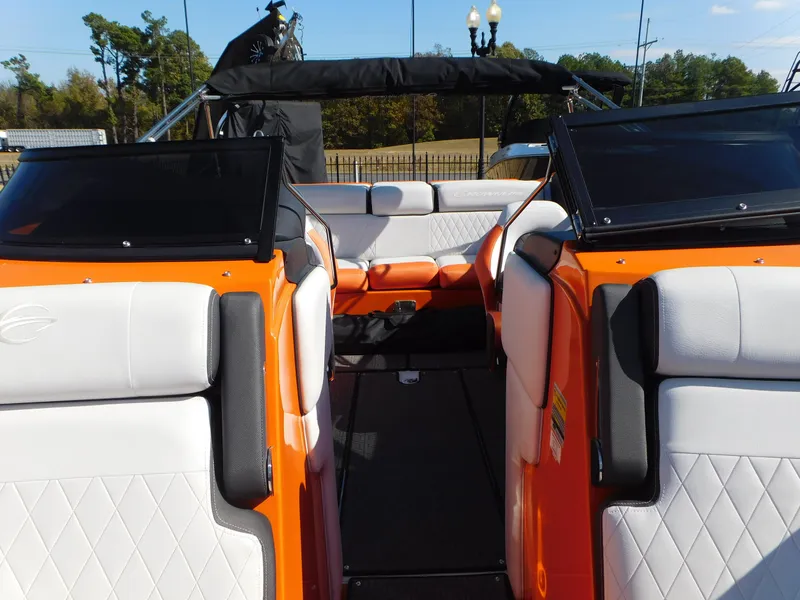 Slide: The Image of 2024 Crownline 240 SS LPX boat interior with orange and white seating. - 9