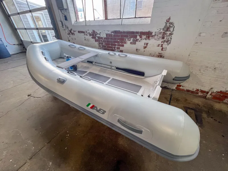 Slide: The Image of 2023 AB Inflatables Ventus 10 VL inflatable boat in a warehouse. - 0