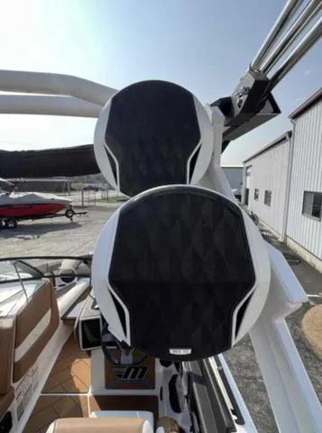 Slide: The Image of 2023 Malibu 26 LSV boat with dual tower speakers. - 9