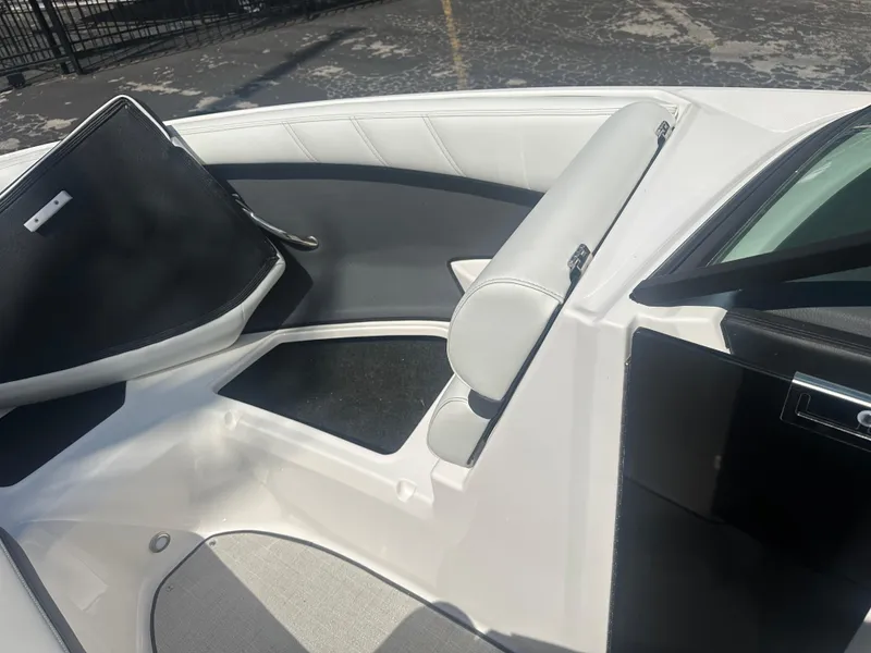 Slide: The Image of 2023 Regal 21 OBX boat interior with white and gray seating. - 16