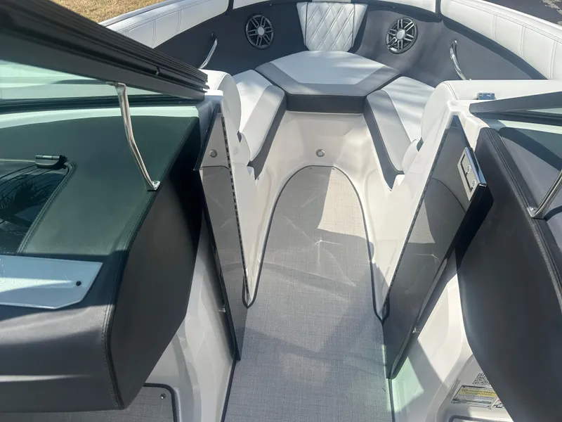 Slide: The Image of 2023 Regal 21 OBX boat interior with seating and speakers, featuring modern design and comfort. - 19