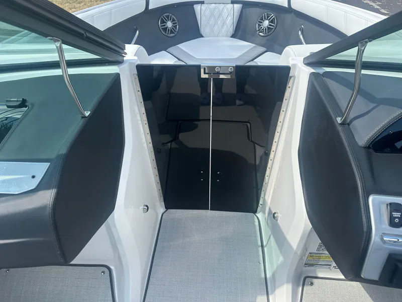 Slide: The Image of 2023 Regal 21 OBX boat interior with open bow seating and modern design. - 20