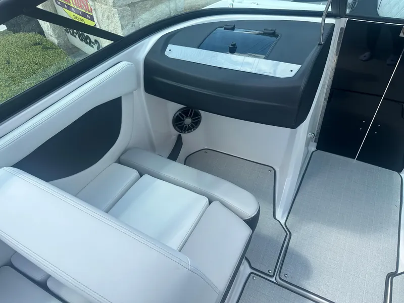 Slide: The Image of 2023 Regal 21 OBX boat interior with seating and speaker detail. - 22