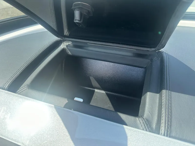 Slide: The Image of Open storage compartment in 2023 Regal 21 OBX boat. - 23