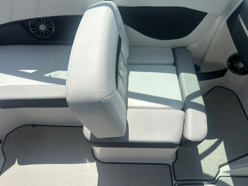 Slide: The Image of 2023 Regal 21 OBX boat interior with gray seating and speaker detail. - 24