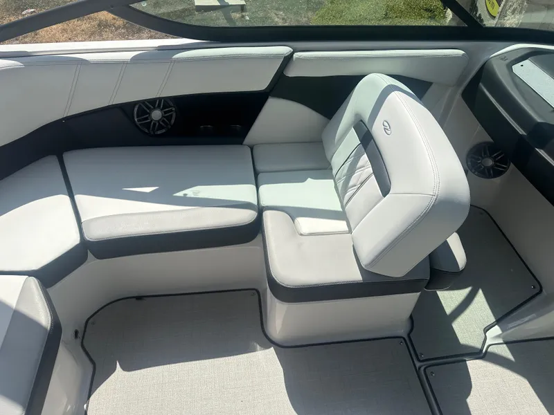 Slide: The Image of 2023 Regal 21 OBX boat interior with sleek, modern seating and stylish design. - 25