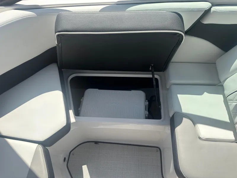 Slide: The Image of 2023 Regal 21 OBX boat interior with open storage compartment. - 26