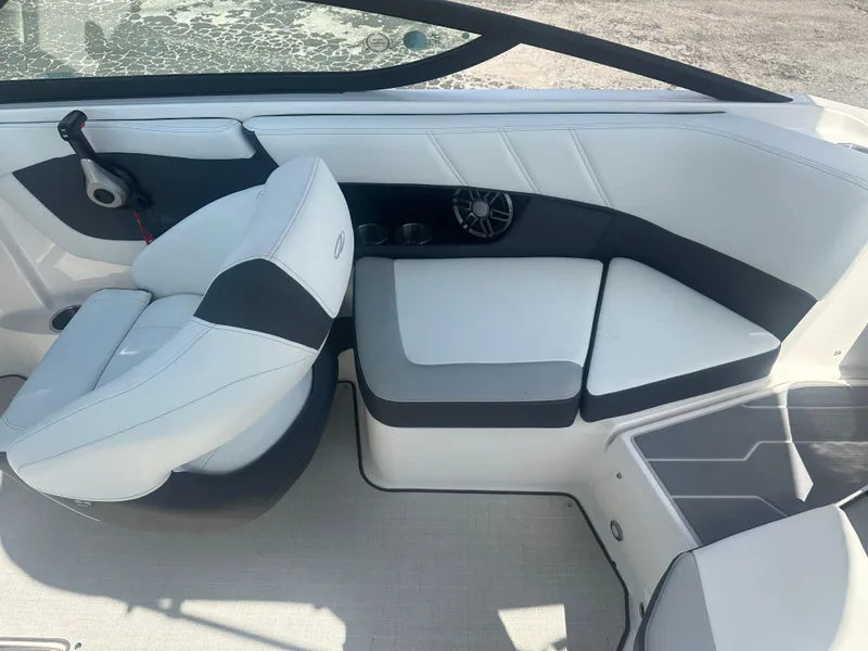 Slide: The Image of 2023 Regal 21 OBX boat interior with white and gray seating. - 27