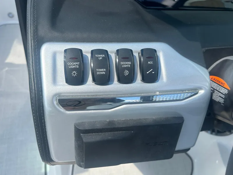 Slide: The Image of Control panel of 2023 Regal 21 OBX boat with cockpit and docking light switches. - 37