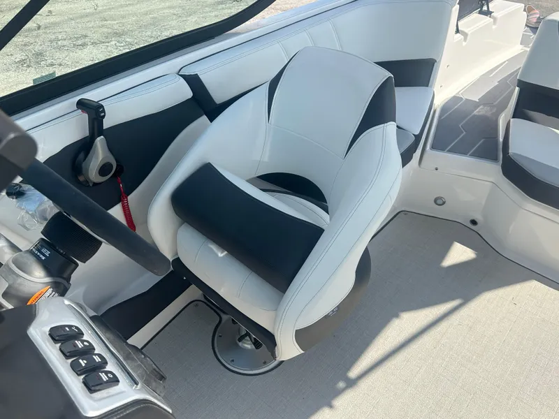 Slide: The Image of 2023 Regal 21 OBX boat interior with modern seating and control panel. - 43